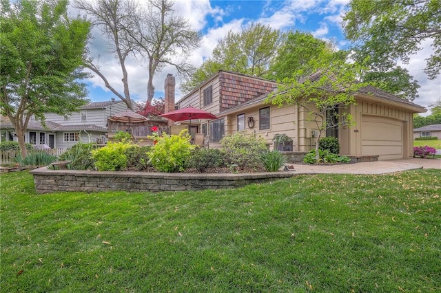 9015 Outlook Dr, Overland Park, KS 66207 - view of front of property featuring a garage, a front lawn, and driveway