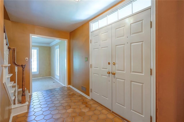 9015 Outlook Dr, Overland Park, KS 66207 - foyer featuring stairs and crown molding