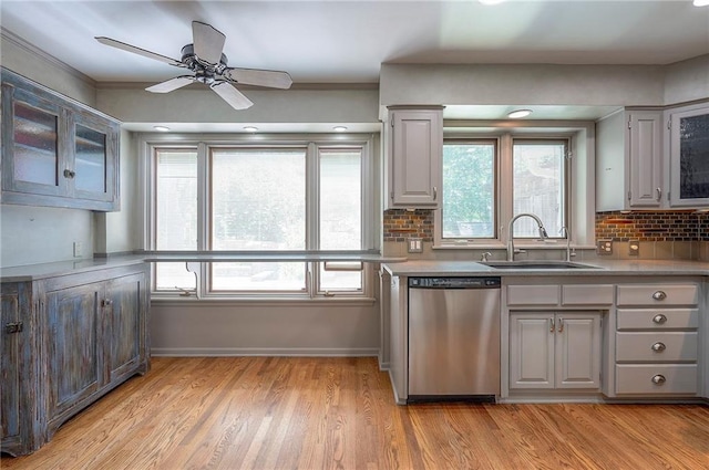 9015 Outlook Dr, Overland Park, KS 66207 - kitchen featuring stainless steel dishwasher, gray cabinetry, decorative backsplash, light countertops, and recessed lighting