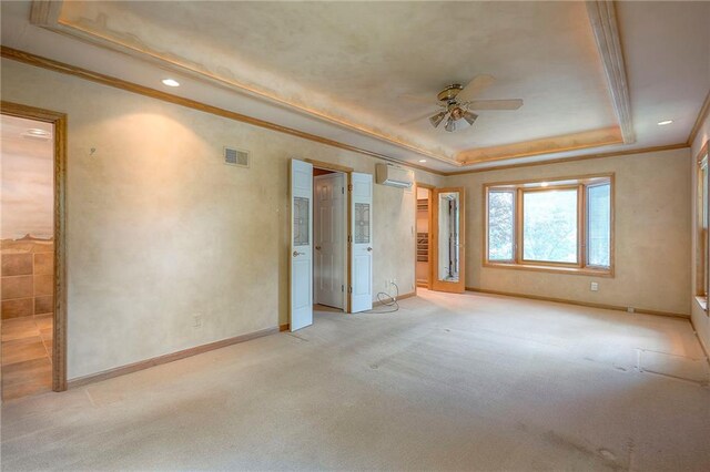 9015 Outlook Dr, Overland Park, KS 66207 - unfurnished bedroom with a tray ceiling, ornamental molding, light carpet, a wall mounted AC, and recessed lighting