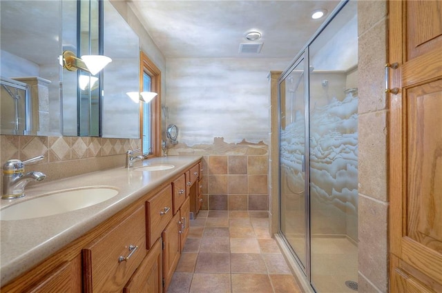 9015 Outlook Dr, Overland Park, KS 66207 - full bath featuring double vanity, a stall shower, tile walls, and backsplash