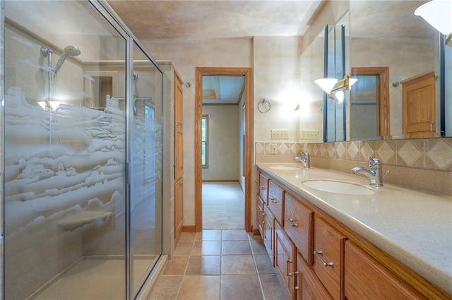9015 Outlook Dr, Overland Park, KS 66207 - bathroom featuring double vanity, a stall shower, tile patterned floors, and decorative backsplash