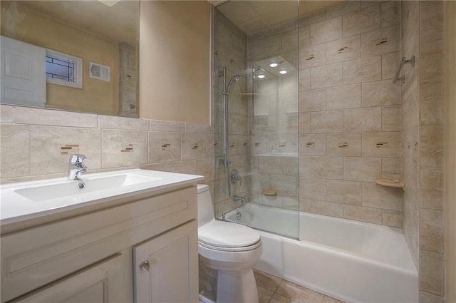 9015 Outlook Dr, Overland Park, KS 66207 - full bath featuring tile walls, vanity, tub / shower combination, and tile patterned floors