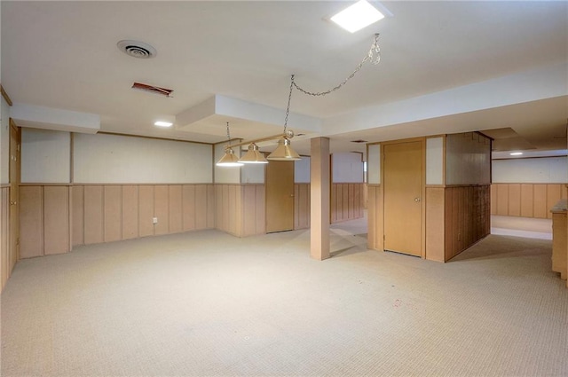 9015 Outlook Dr, Overland Park, KS 66207 - finished below grade area with light carpet and a wainscoted wall