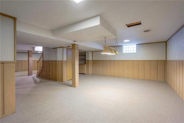 9015 Outlook Dr, Overland Park, KS 66207 - basement featuring light colored carpet, wainscoting, and stairs
