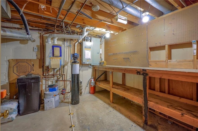 9015 Outlook Dr, Overland Park, KS 66207 - unfinished basement with a workshop area and electric panel