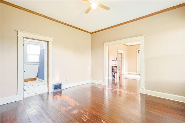 2627 Renick St, Saint Joseph, MO 64507 - spare room featuring ceiling fan, ornamental molding, and hardwood / wood-style flooring