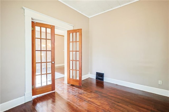 2627 Renick St, Saint Joseph, MO 64507 - unfurnished room with french doors, ornamental molding, and hardwood / wood-style flooring