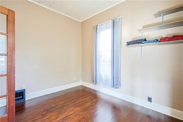 2627 Renick St, Saint Joseph, MO 64507 - empty room with wood-type flooring and crown molding