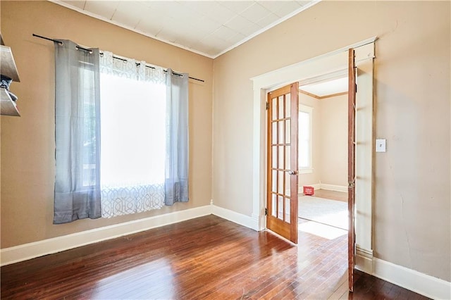 2627 Renick St, Saint Joseph, MO 64507 - spare room featuring wood-type flooring, french doors, and ornamental molding