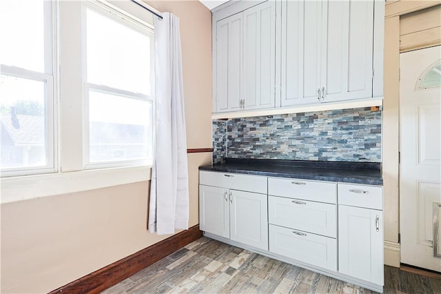 2627 Renick St, Saint Joseph, MO 64507 - kitchen with healthy amount of natural light, tasteful backsplash, and dark countertops