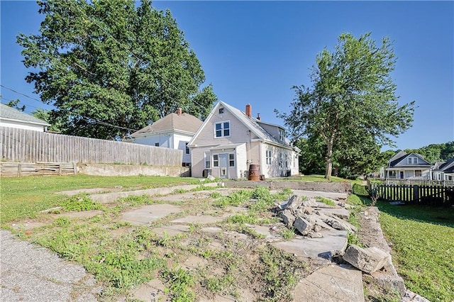 2627 Renick St, Saint Joseph, MO 64507 - back of house featuring a chimney