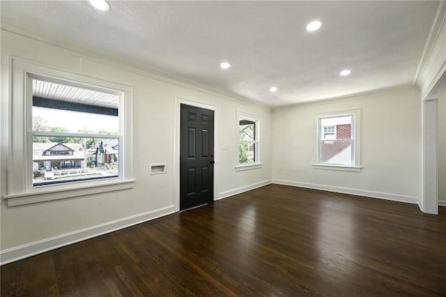 5236 Woodland Ave, Kansas City, MO 64110 - entryway with crown molding, wood finished floors, and recessed lighting