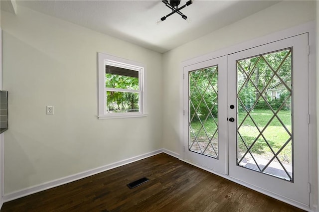 5236 Woodland Ave, Kansas City, MO 64110 - entryway with french doors and dark wood finished floors