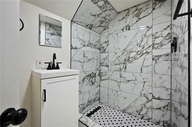 5236 Woodland Ave, Kansas City, MO 64110 - bathroom featuring a tile shower and vanity