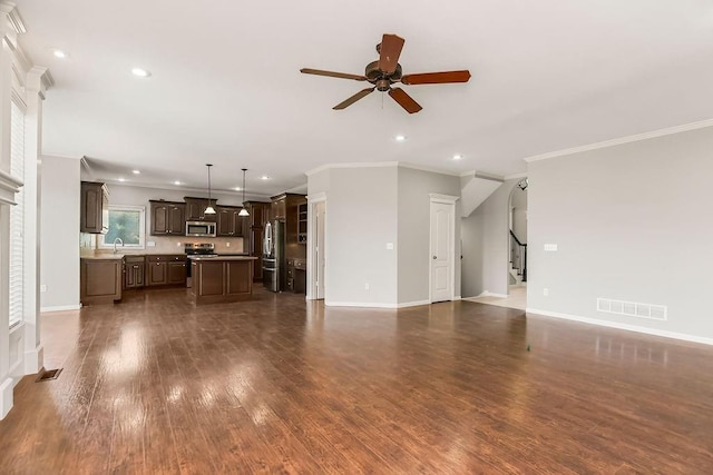 16211 S Locust St, Olathe, KS 66062 - unfurnished living room with ceiling fan, crown molding, stairs, recessed lighting, and dark wood-style floors