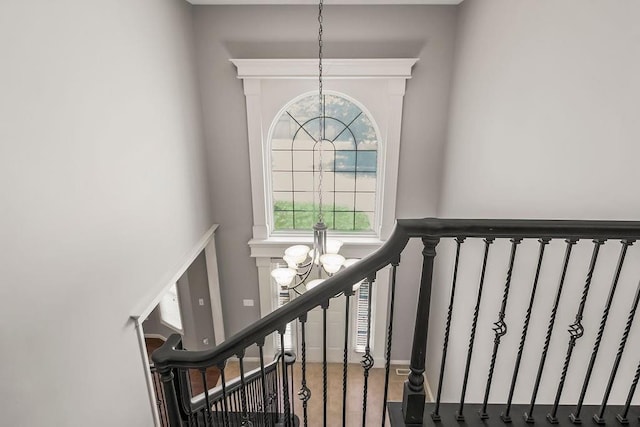 16211 S Locust St, Olathe, KS 66062 - stairway featuring a chandelier