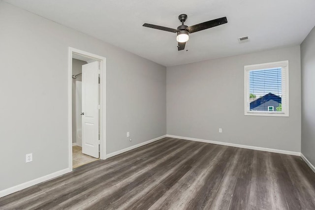16211 S Locust St, Olathe, KS 66062 - unfurnished bedroom with wood finished floors, ceiling fan, and connected bathroom