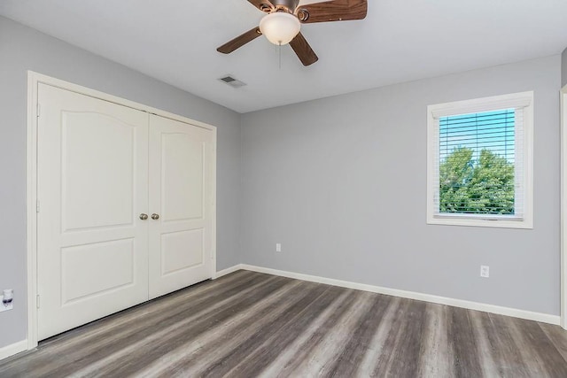 16211 S Locust St, Olathe, KS 66062 - unfurnished bedroom featuring wood finished floors, a closet, and ceiling fan