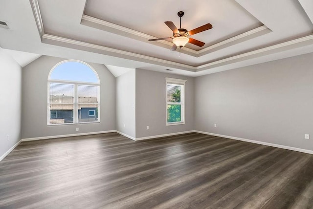 16211 S Locust St, Olathe, KS 66062 - empty room featuring a tray ceiling, ornamental molding, ceiling fan, and dark wood finished floors