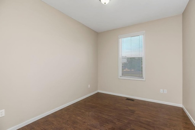 16211 S Locust St, Olathe, KS 66062 - unfurnished room featuring dark wood-type flooring and baseboards