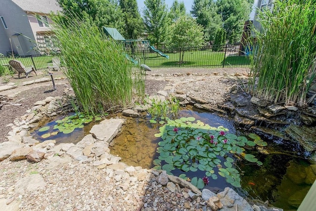16211 S Locust St, Olathe, KS 66062 - view of yard featuring a garden pond