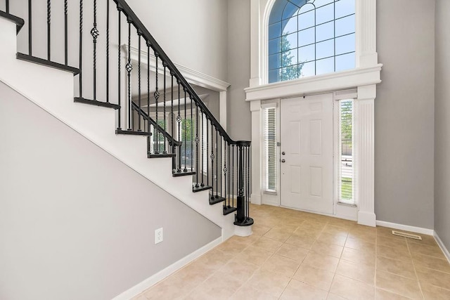 16211 S Locust St, Olathe, KS 66062 - tiled entrance foyer with a high ceiling and stairway