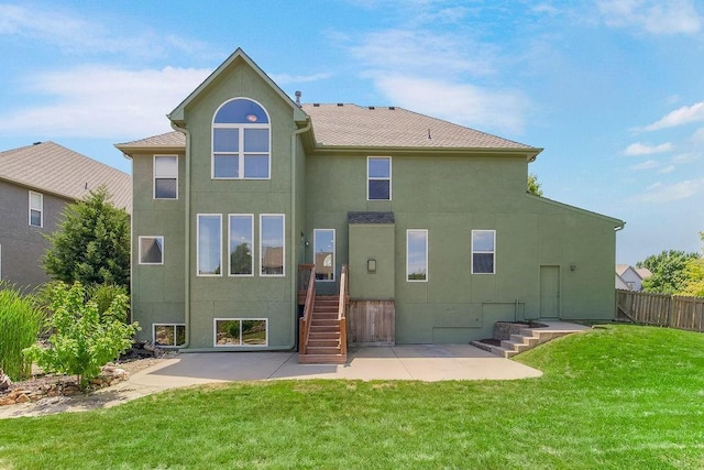 16211 S Locust St, Olathe, KS 66062 - rear view of property featuring stucco siding and a patio area
