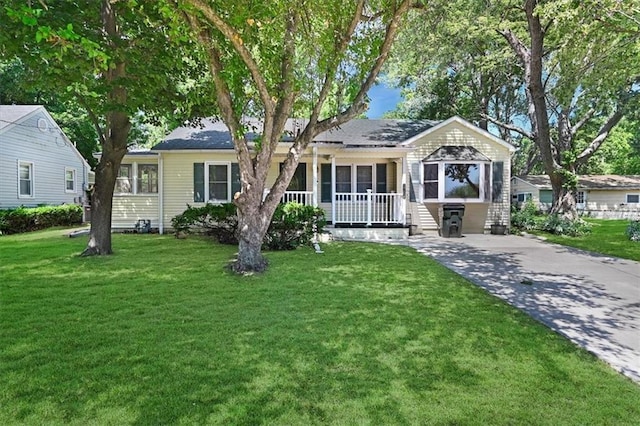 2704 Garland St, Leavenworth, KS 66048 - view of front of property with a front lawn and covered porch