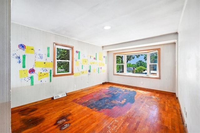 2704 Garland St, Leavenworth, KS 66048 - unfurnished room featuring wood finished floors and healthy amount of natural light