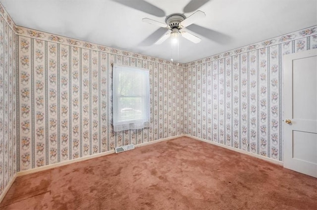 2704 Garland St, Leavenworth, KS 66048 - carpeted empty room with a ceiling fan and baseboards