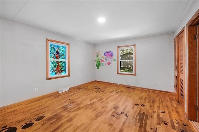 2704 Garland St, Leavenworth, KS 66048 - unfurnished bedroom with wood finished floors and recessed lighting