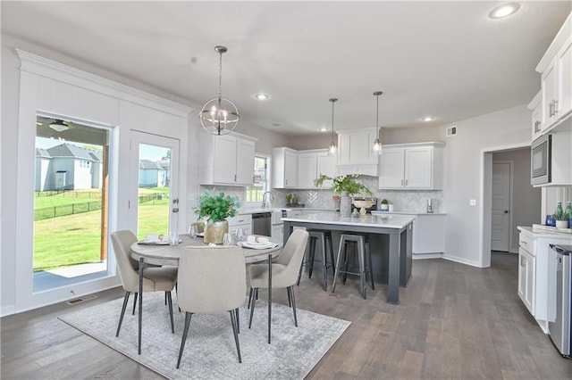 6122 Lewis Dr, Shawnee, KS 66226 - dining space with recessed lighting and dark wood-type flooring