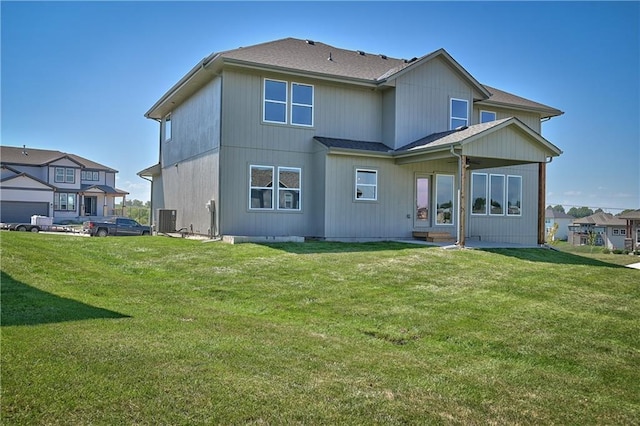 6122 Lewis Dr, Shawnee, KS 66226 - back of house with a yard and a shingled roof