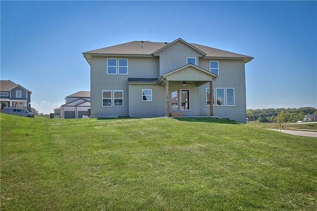 6122 Lewis Dr, Shawnee, KS 66226 - rear view of property featuring a ceiling fan and a yard