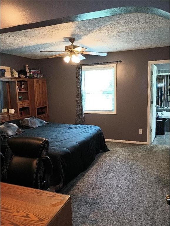 1712 S Hands St, Independence, MO 64055 - carpeted bedroom featuring a ceiling fan and a textured ceiling
