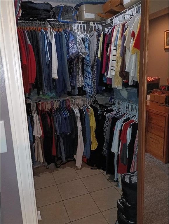 1712 S Hands St, Independence, MO 64055 - spacious closet featuring light tile patterned floors