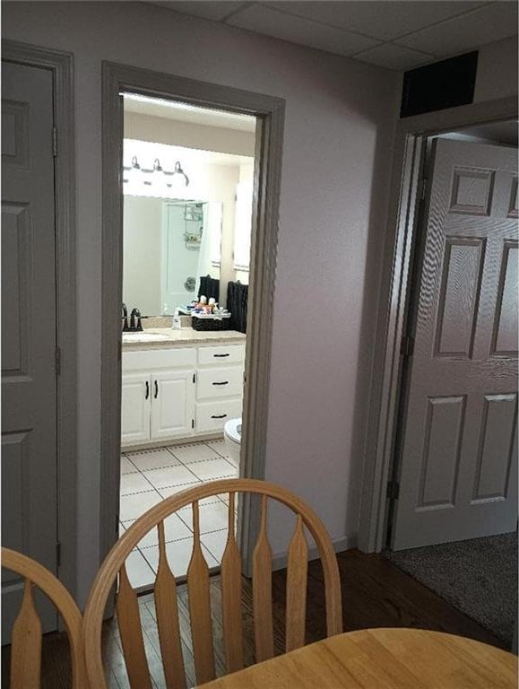 1712 S Hands St, Independence, MO 64055 - corridor with a sink and a drop ceiling