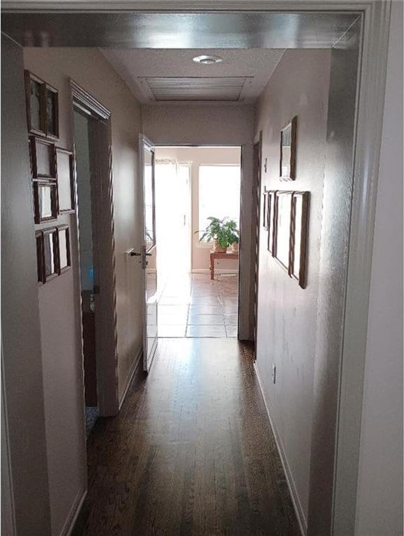 1712 S Hands St, Independence, MO 64055 - corridor with dark wood-type flooring and baseboards