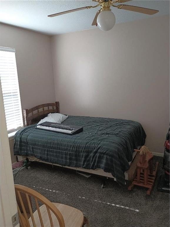 1712 S Hands St, Independence, MO 64055 - carpeted bedroom featuring ceiling fan