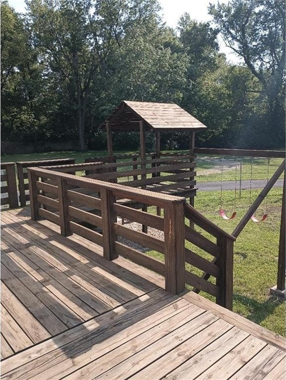 1712 S Hands St, Independence, MO 64055 - wooden terrace featuring a yard