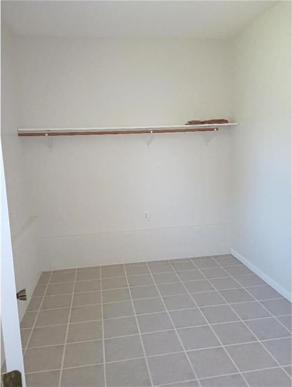 1712 S Hands St, Independence, MO 64055 - walk in closet with tile patterned flooring