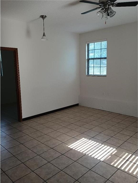 1712 S Hands St, Independence, MO 64055 - unfurnished room with ceiling fan and light tile patterned floors