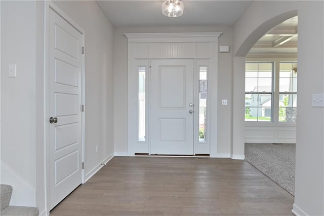 6108 Lewis Dr, Shawnee, KS 66226 - entryway featuring arched walkways and wood finished floors