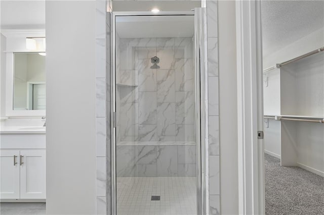 6108 Lewis Dr, Shawnee, KS 66226 - bathroom with a marble finish shower, vanity, and a walk in closet