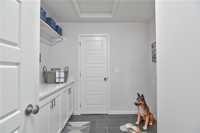 6108 Lewis Dr, Shawnee, KS 66226 - laundry area featuring dark tile patterned floors and baseboards
