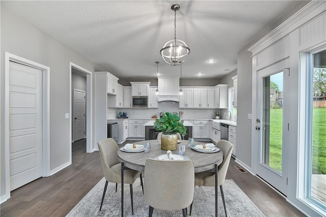 6118 Lewis Dr, Shawnee, KS 66226 - dining room featuring dark wood-style flooring, a chandelier, and recessed lighting