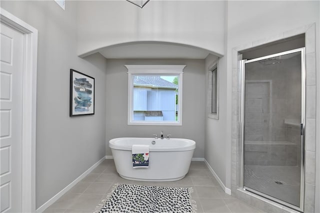 6118 Lewis Dr, Shawnee, KS 66226 - bathroom featuring a stall shower, tile patterned floors, and a freestanding bath