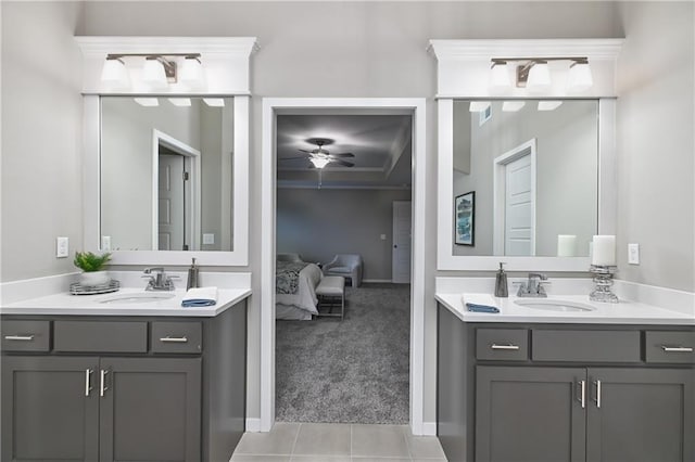 6118 Lewis Dr, Shawnee, KS 66226 - ensuite bathroom featuring two vanities, a ceiling fan, tile patterned floors, and crown molding
