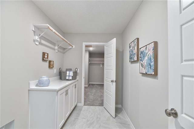 6118 Lewis Dr, Shawnee, KS 66226 - laundry area with baseboards and light marble finish floors